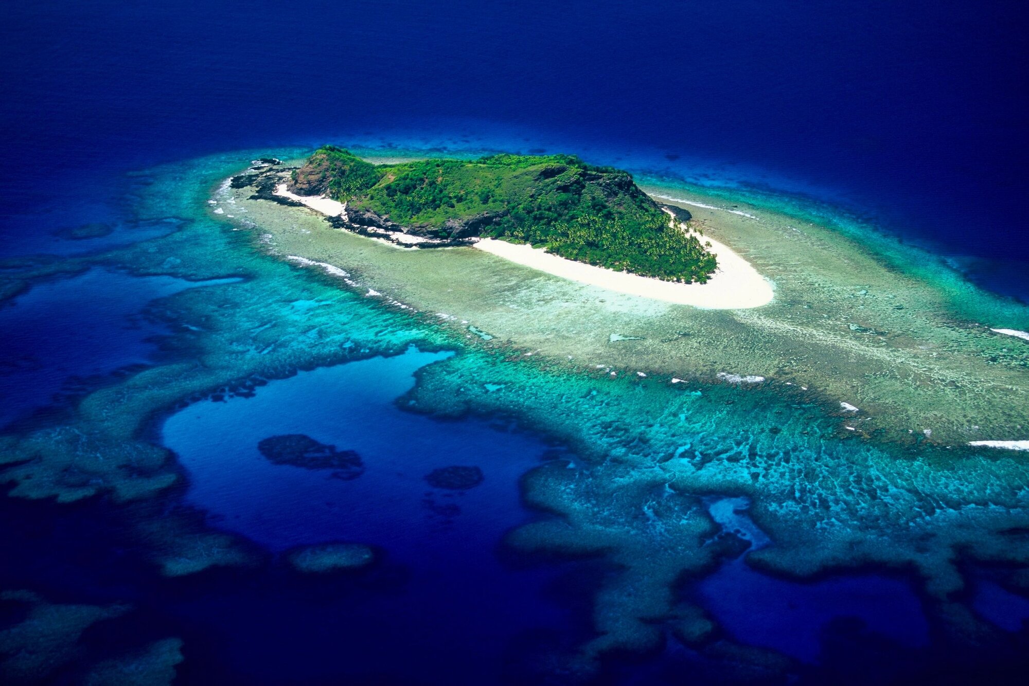 High aerial of Eori ringed by full reef system