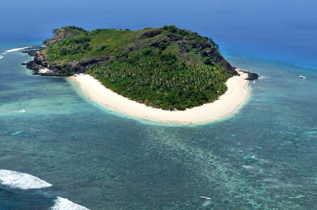 Aerial of Eori’s main beach and turquoise reef