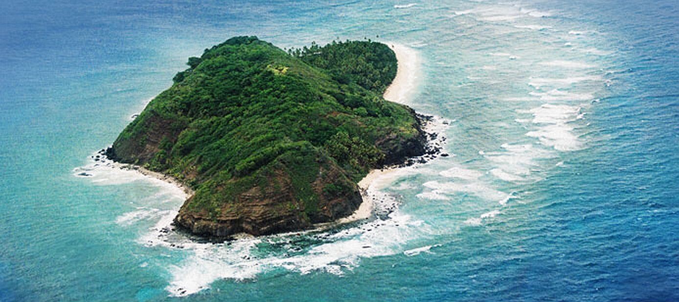 Eori Island from above — light footprint on reef and forest